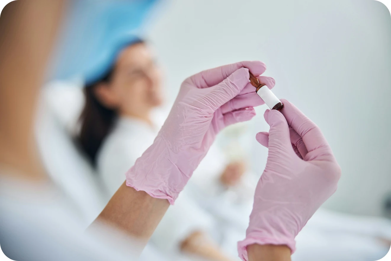 Healthcare professional preparing IV therapy equipment