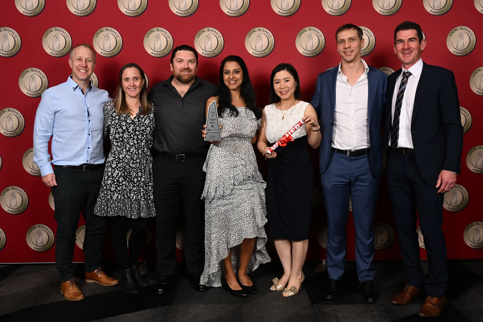 The Modia Health group celebrating with its 2026 Local Business Awards trophy